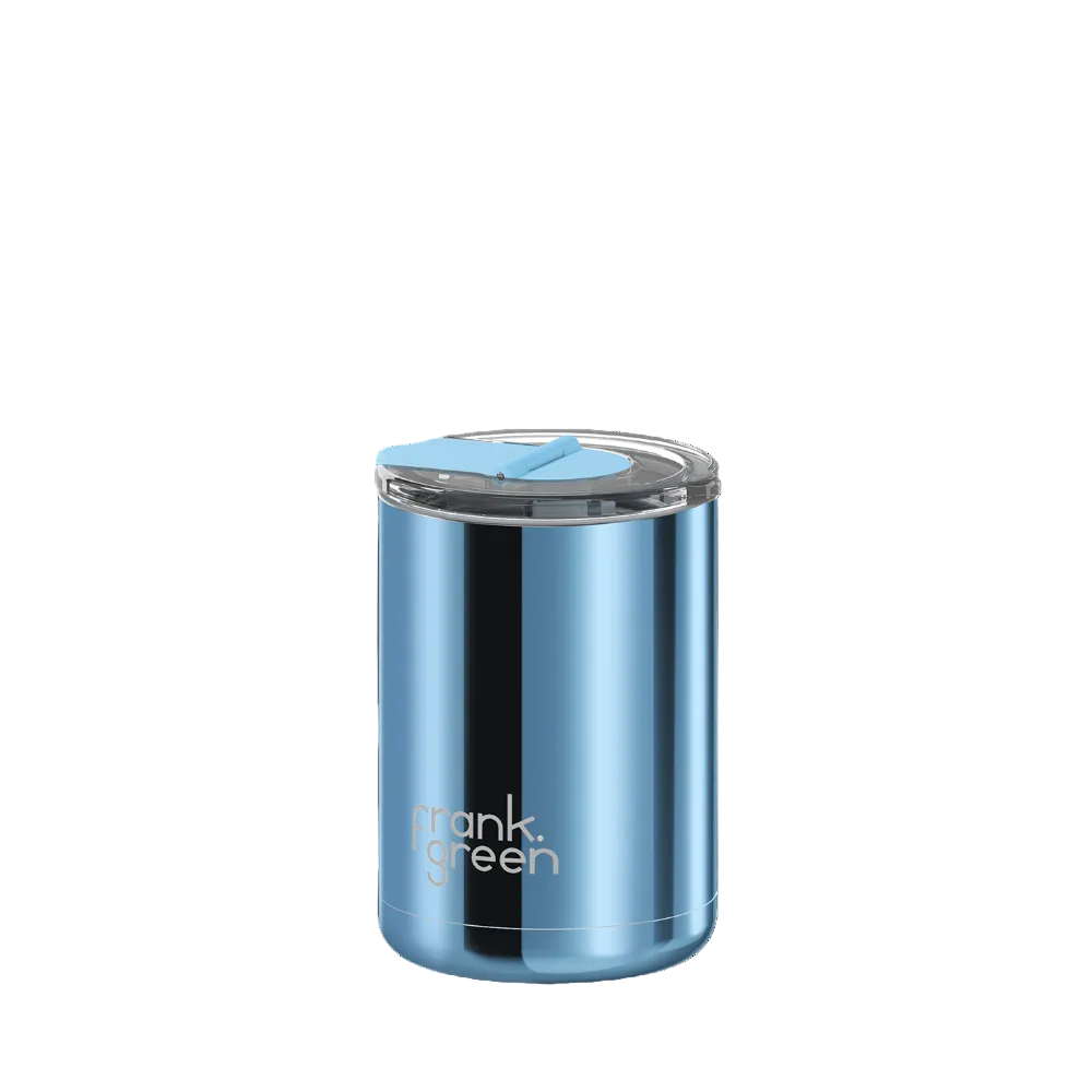 A metallic blue insulated tumbler with a clear lid and light blue flip straw, featuring the 'frank green' logo near the bottom, set against a solid white background.