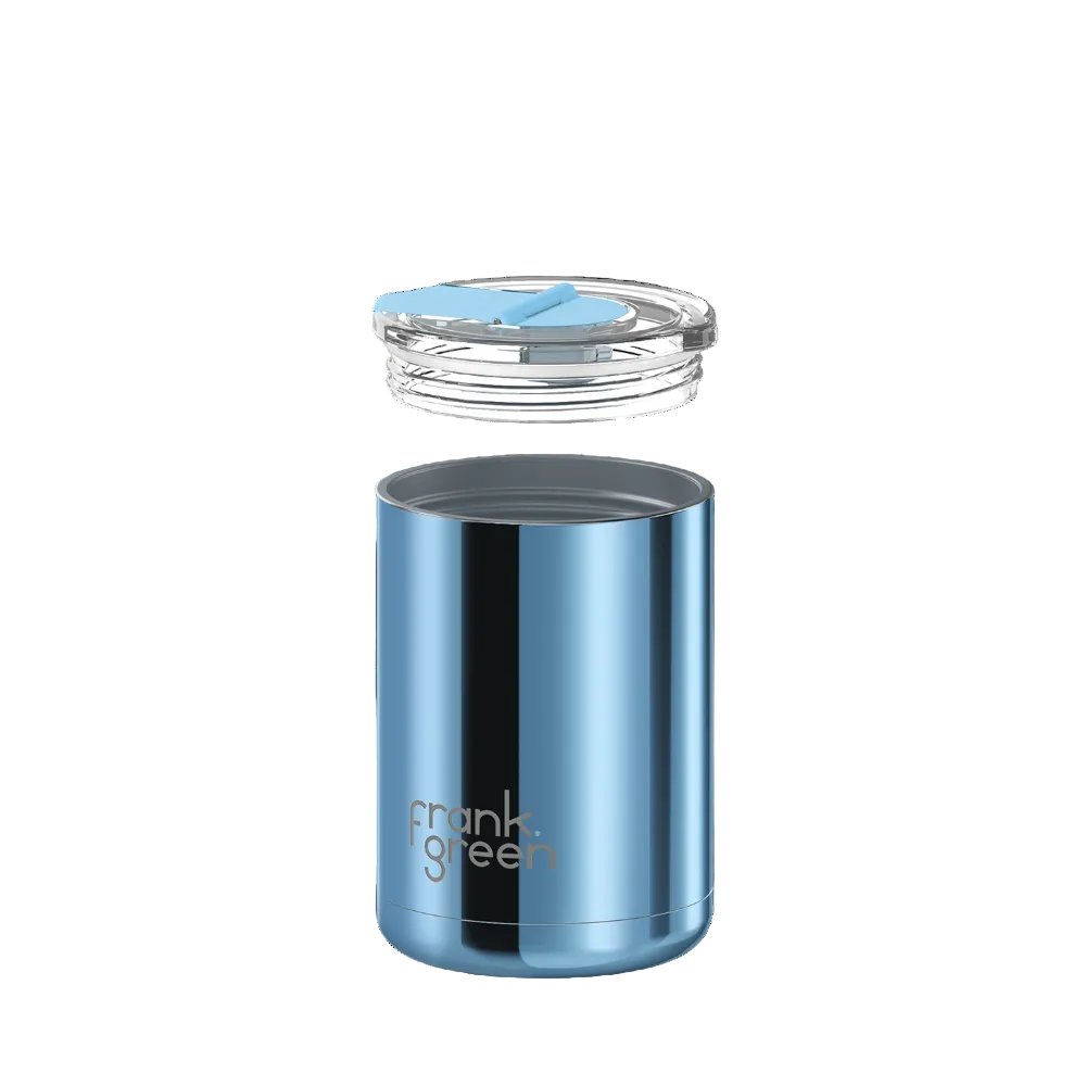 A blue stainless steel travel tumbler with a clear lid and light blue flip straw, shown floating against a solid white background. The brand name 'frank green' is printed on the front.