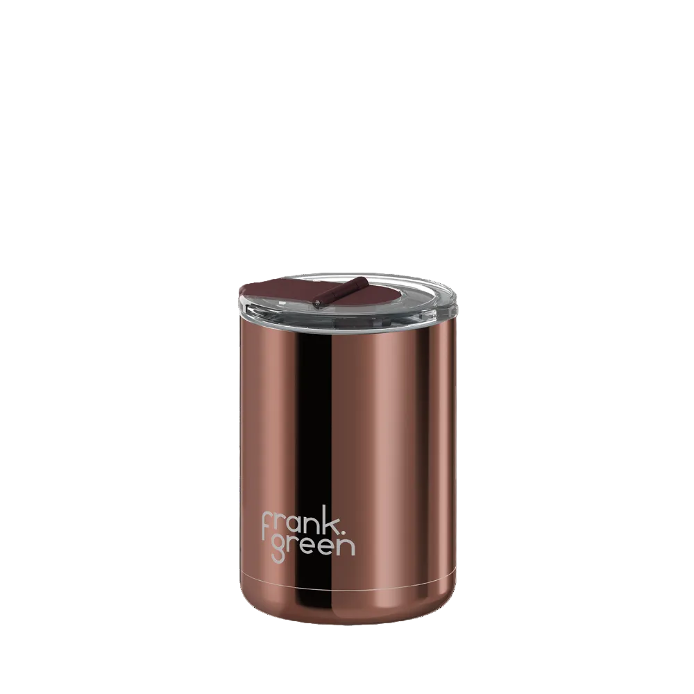 A metallic copper-colored Frank Green travel tumbler with a clear lid and dark brown flip-top straw, shown on a plain white background.