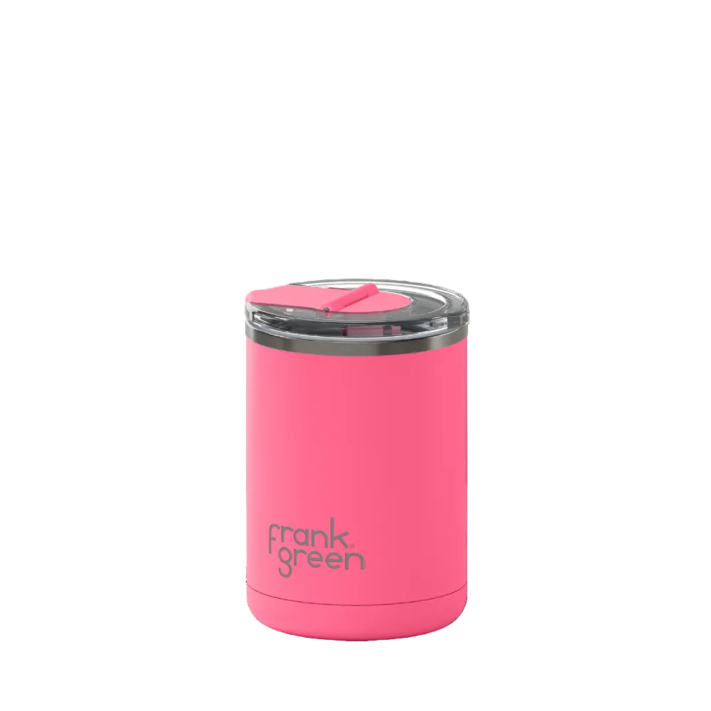 A bright pink vacuum-insulated tumbler with a clear lid and pink flip straw, featuring the 'frank green' logo near the bottom, set against a plain white background.