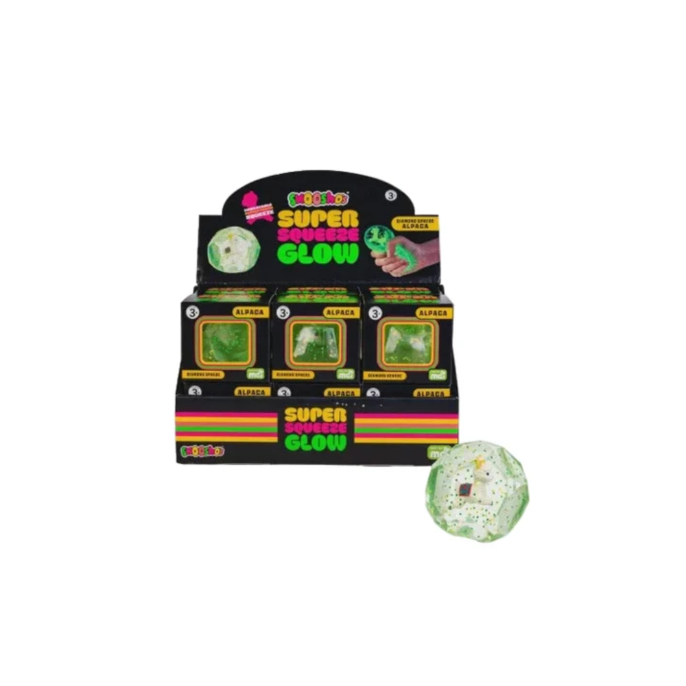 A retail display box of Quoko Super Squeeze Glow Alpaca slime, with three green glow-filled balls visible inside black and yellow packaging, and one loose green-and-white glittery slime ball shown in front on a white background.