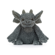 A gray plush dragon toy with large pointed ears, small horns, and a stitched smiling face, photographed against a clean white background.
