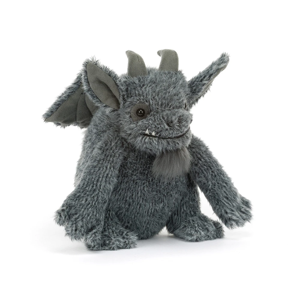 A plush gray dragon toy with small horns, folded wings, and a soft furry texture, photographed on a clean white background.