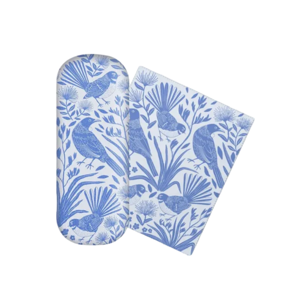 A pair of blue and white patterned glasses cases, one shown closed and the other open to display the interior lining, featuring a blue bird and botanical design on a white background.