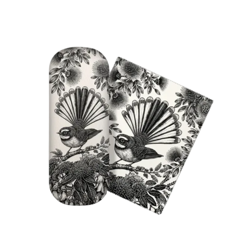A pair of oval sunglasses with a black and white bird and floral pattern, shown with one folded over and one standing upright on a white background.