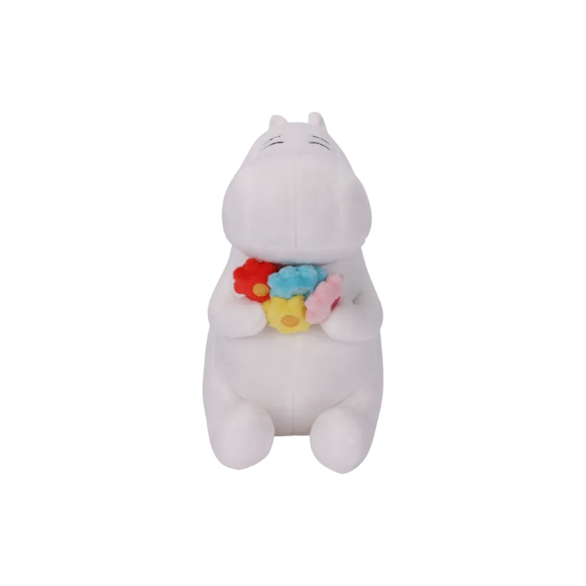 A white plush toy shaped like a sleeping hippopotamus holding a small colorful flower-shaped toy in its paws, shown against a plain white background.