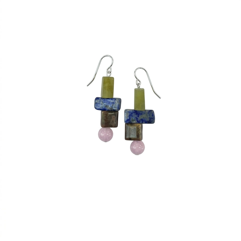 A pair of handmade dangle earrings featuring stacked rectangular beads in olive green, blue, brown, and pink, suspended from silver fishhook wires on a plain white background.