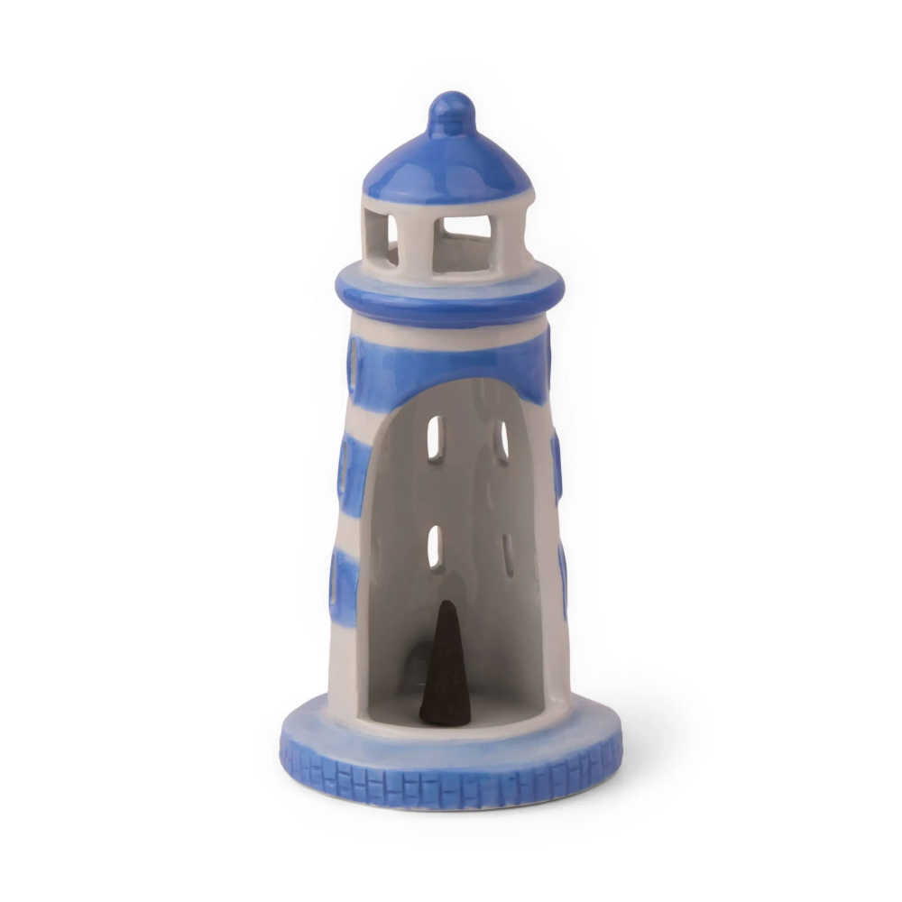 Decorative lighthouse-shaped candle holder with blue and gray stripes on a white background