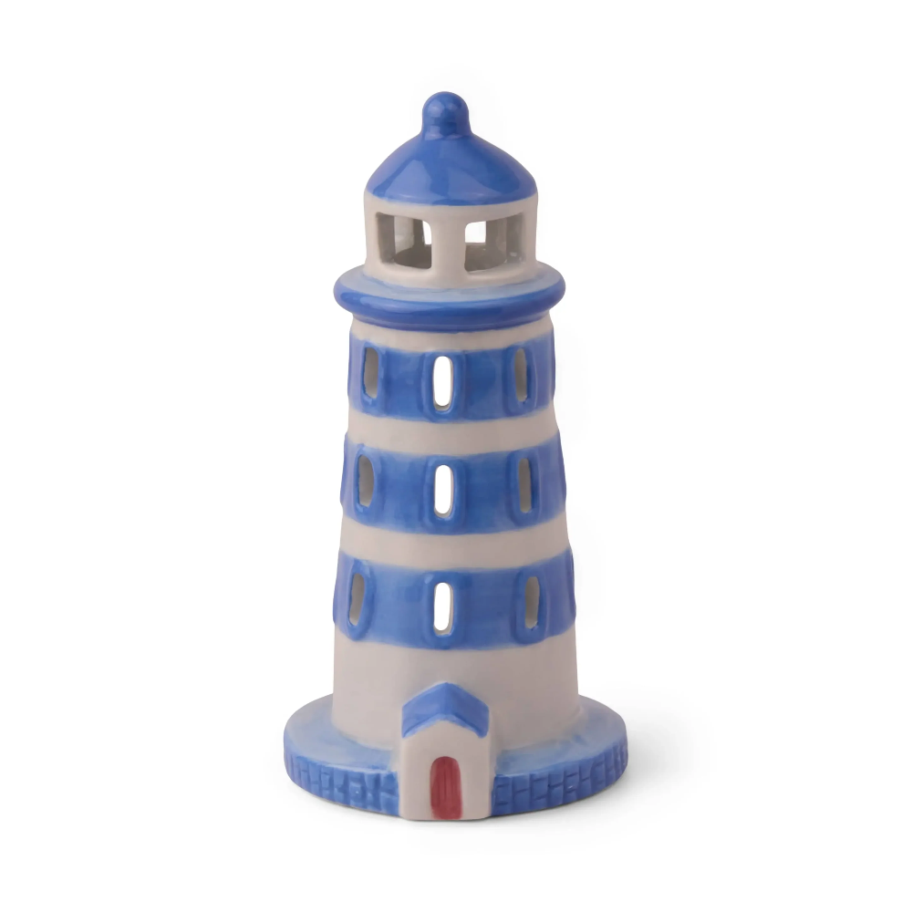 Decorative lighthouse figurine with blue and white stripes on a white background