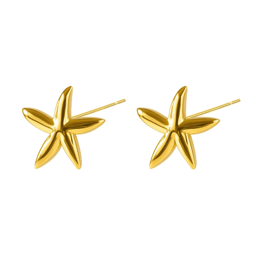 A pair of polished gold starfish stud earrings on a solid white background.