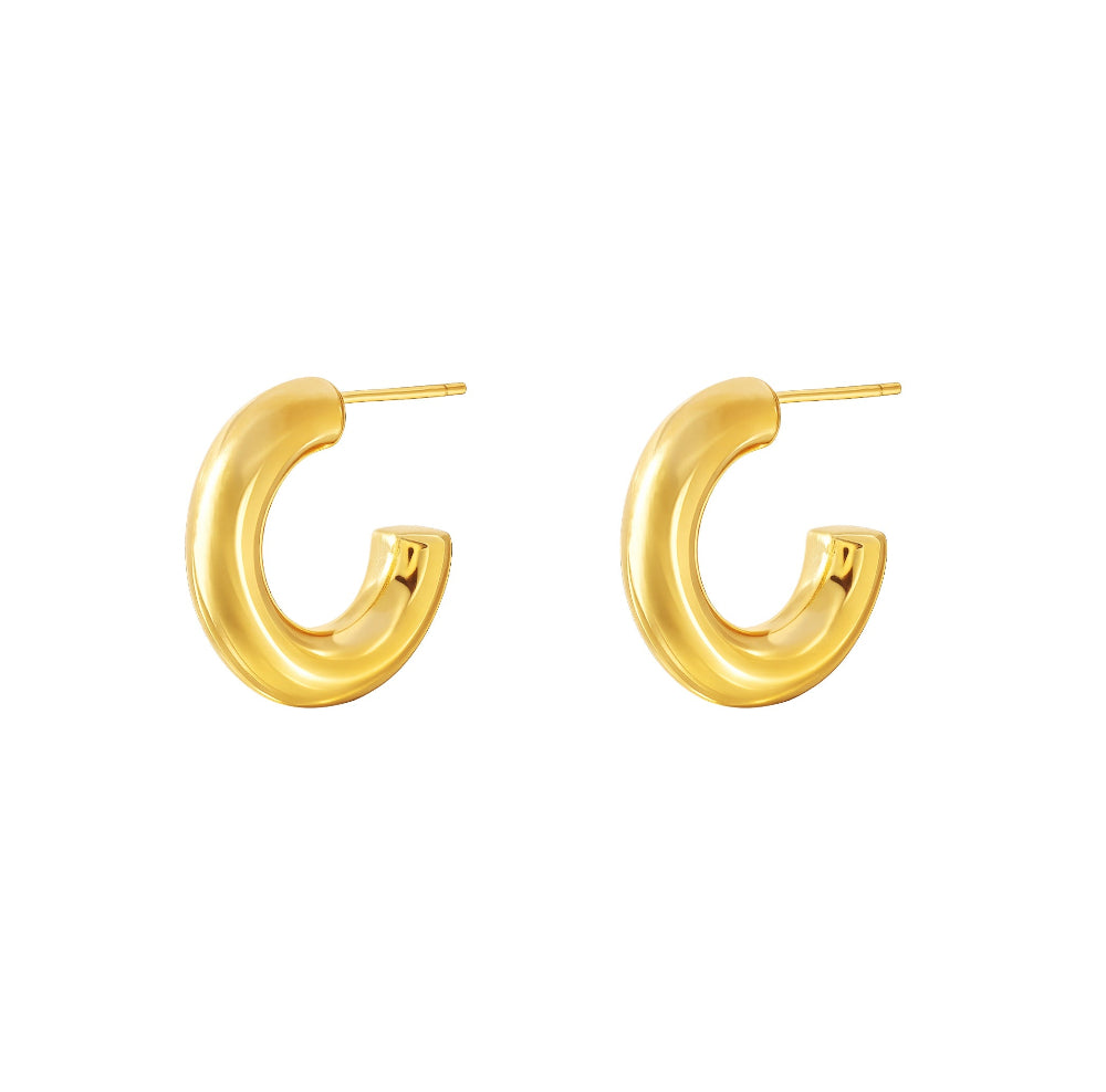 Gold hoop earrings on a white background