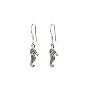 Dangly silver seahorse charm earrings.