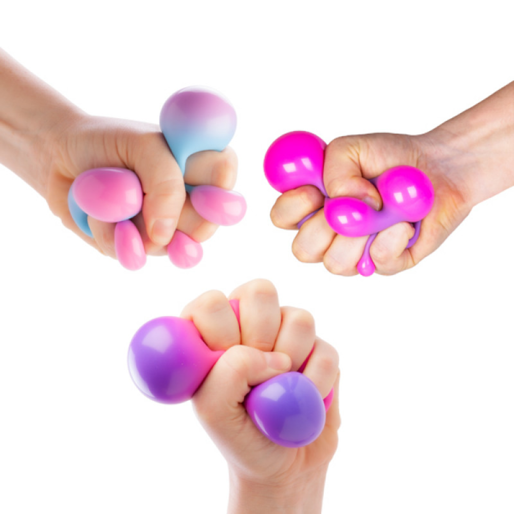 Three hands squeezing pink and purple stress balls against a white background