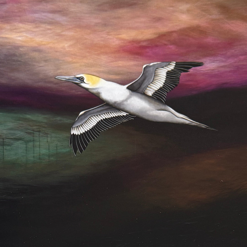 A spiral-bound 2027 monthly calendar featuring a painted northern gull in flight on the cover, displayed on a light wood tabletop.