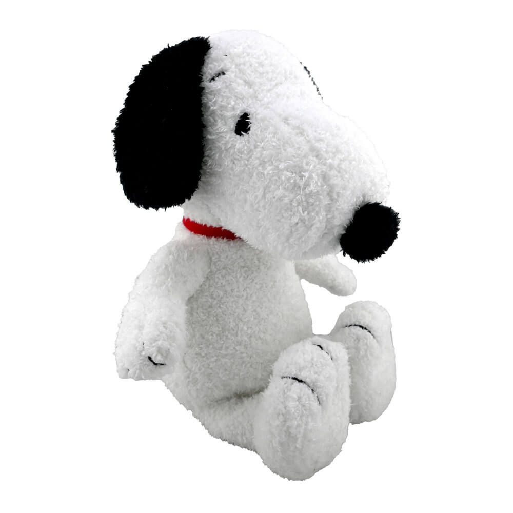 Plush toy resembling a dog with a red collar on a white background