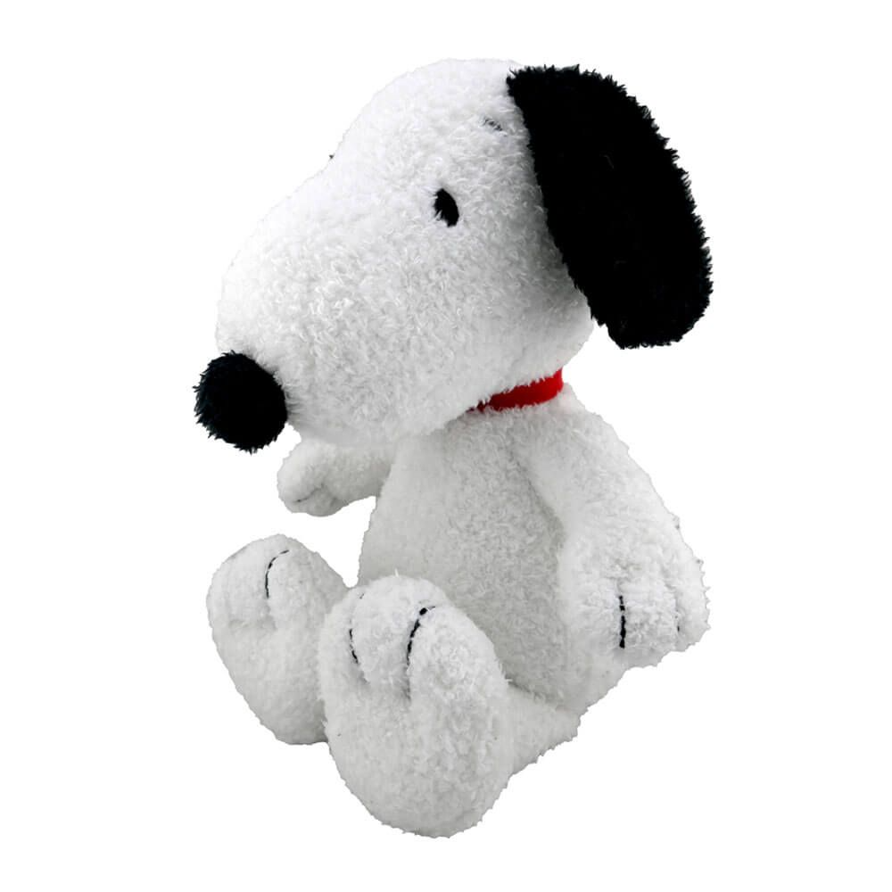 Plush toy resembling a dog with a red collar on a white background