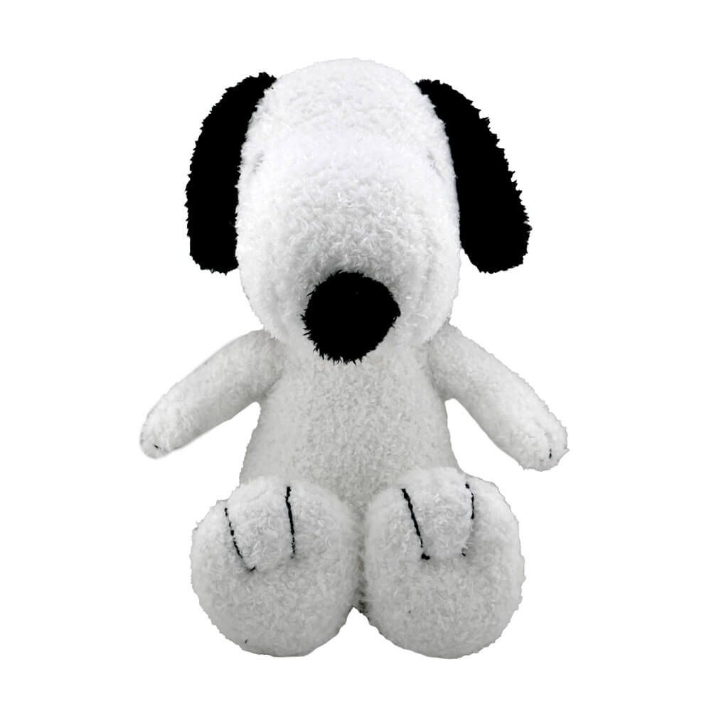 Plush toy resembling a black and white dog on a white background