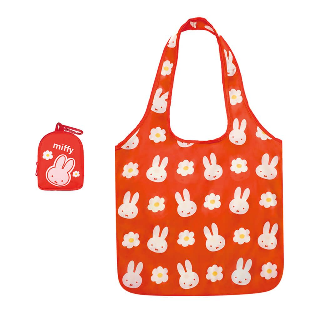 A red reusable tote bag with a white bunny and yellow flower print, shown next to its small matching red zippered pouch featuring the Miffy logo.