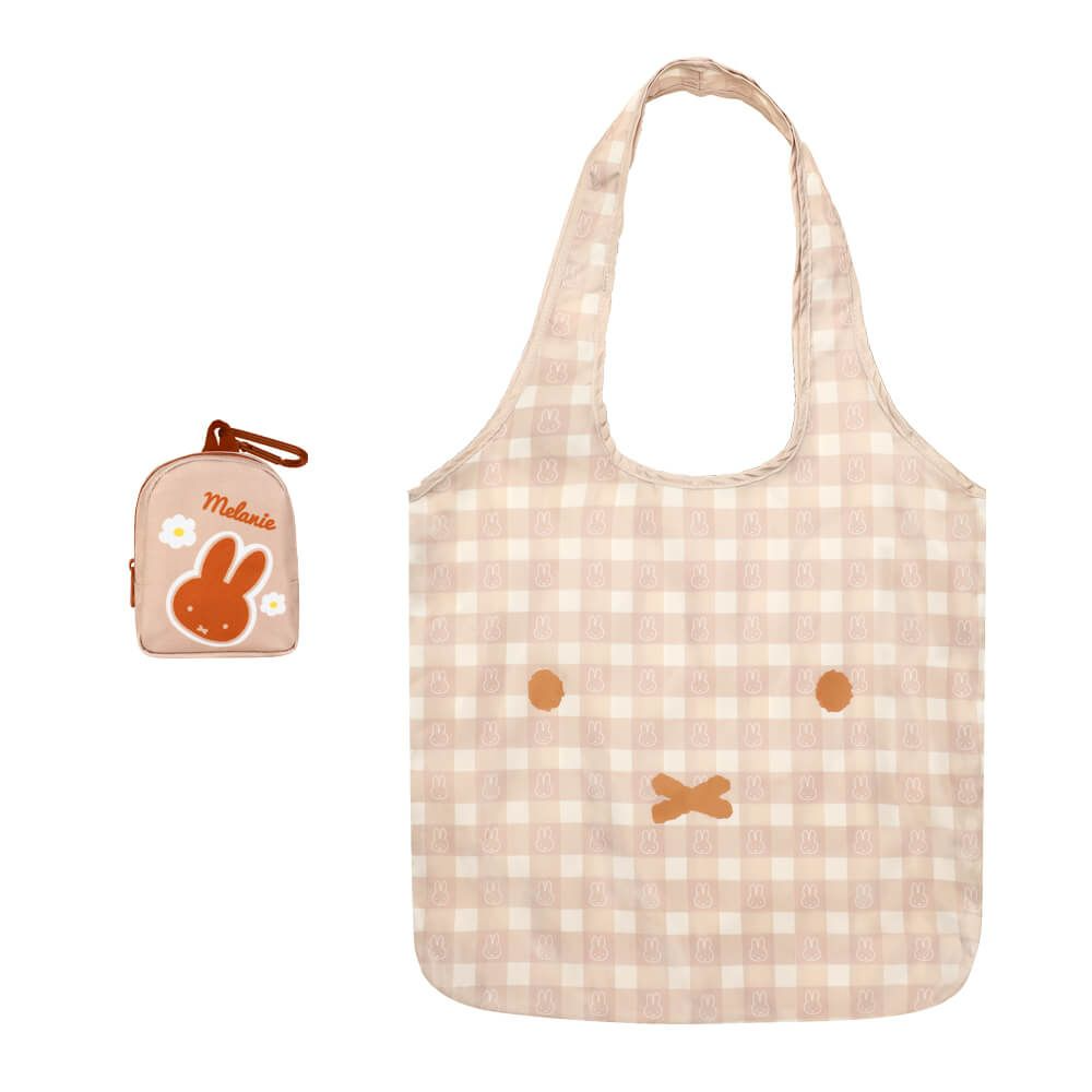 A beige and white gingham reusable tote bag with a rabbit face motif, shown alongside a matching small zip pouch featuring a rabbit illustration and the name 'Miffi'.