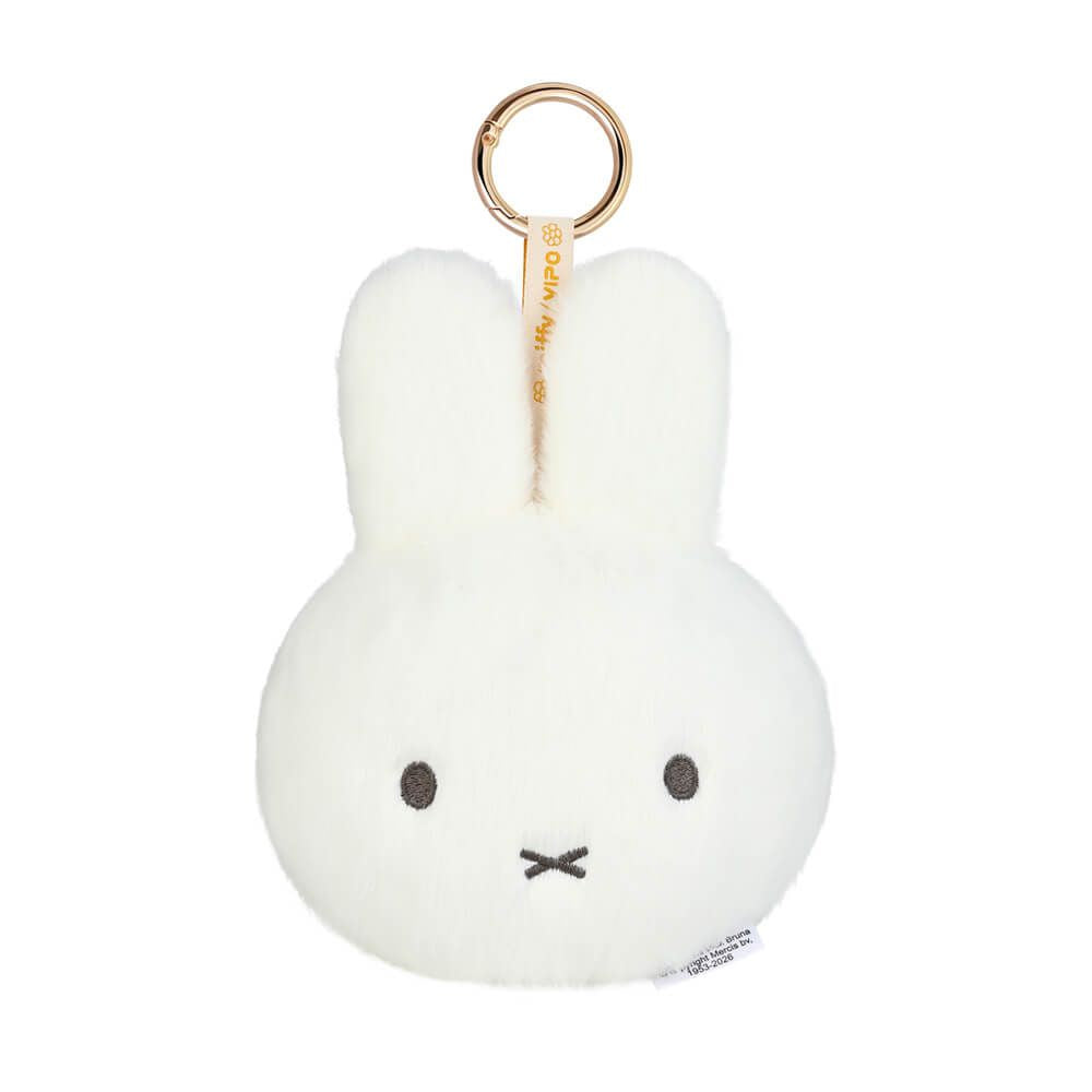 A white plush Miffy bunny keychain with a gold metal key ring and a small white tag, shown on a plain white background.