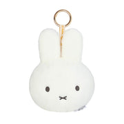 A white plush Miffy bunny keychain with a gold metal key ring and a small white tag, shown on a plain white background.