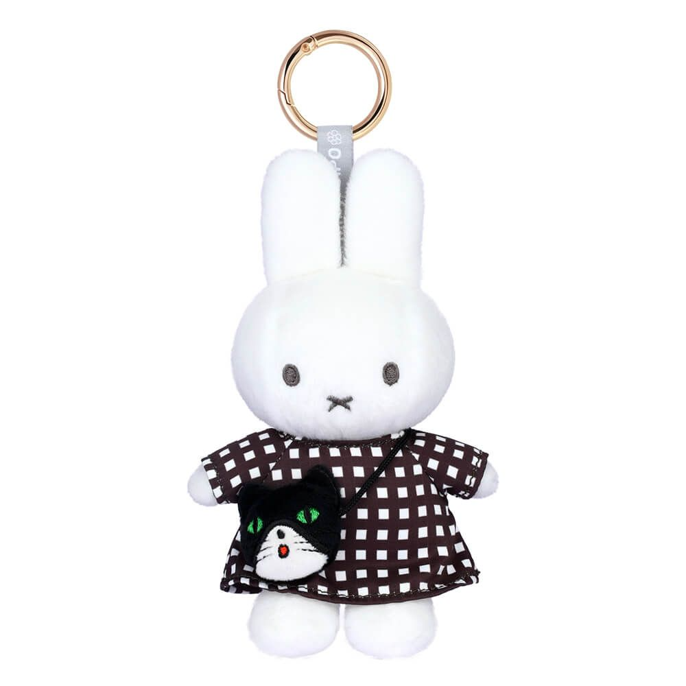 A plush white bunny keychain wearing a brown and white checkered dress with a black cat patch on the front, attached to a gold metal key ring.