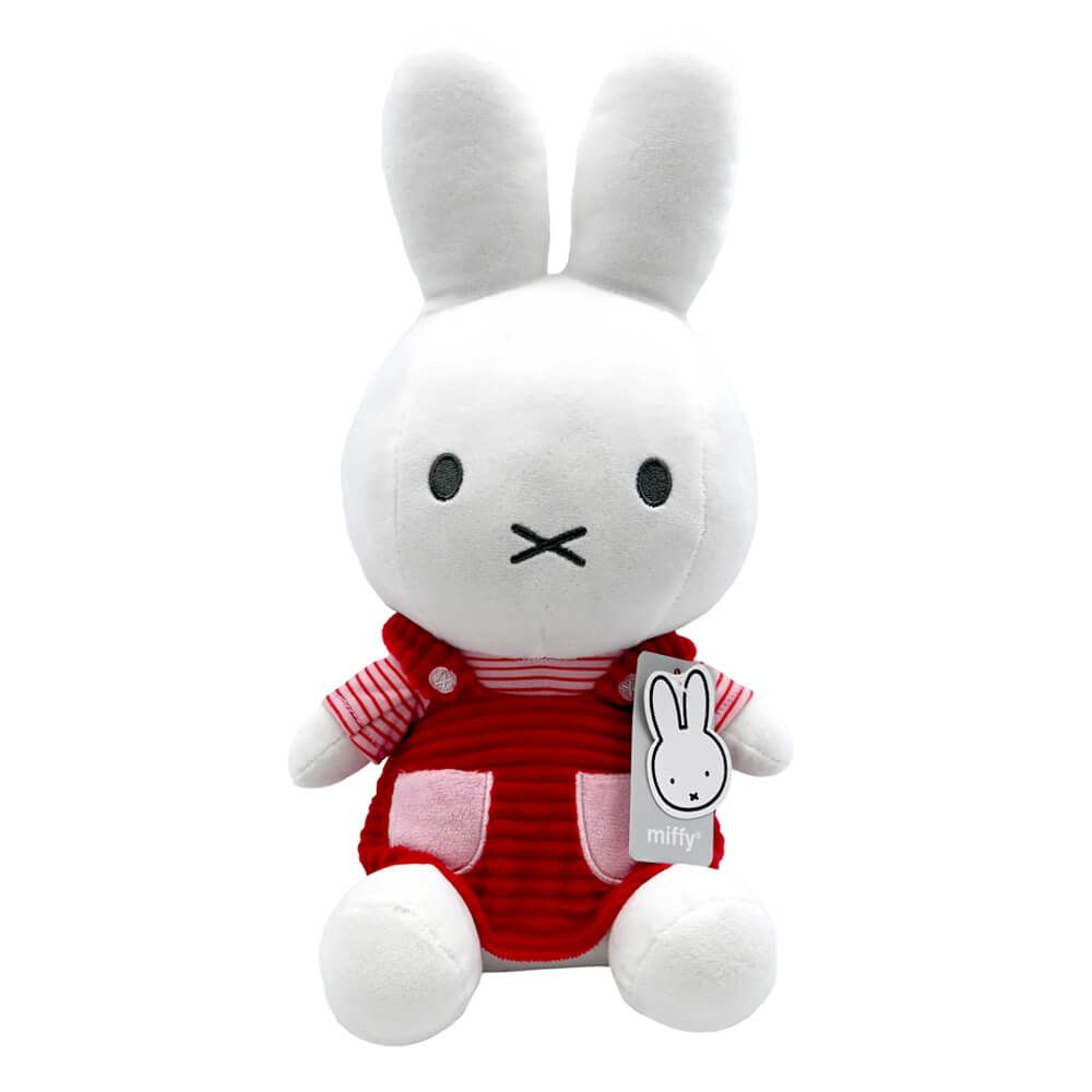 A white plush rabbit toy with long ears, simple black facial features, and a red striped outfit with pink pocket details, shown on a plain white background. A small hangtag is attached to the front.