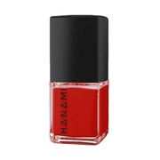 A bottle of Hanami nail polish in a vibrant red shade, featuring a black cap and a clear glass base with the brand name 'HANAMI' printed vertically in black.