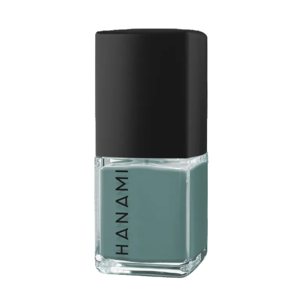 A bottle of Hanami nail polish in a muted sage green shade, featuring a black cap and clear glass bottle, shown on a solid white background.