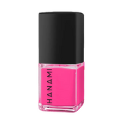 A bottle of Hanami nail polish in a vibrant hot pink shade, featuring a black cap and clear glass base, set against a plain white background.