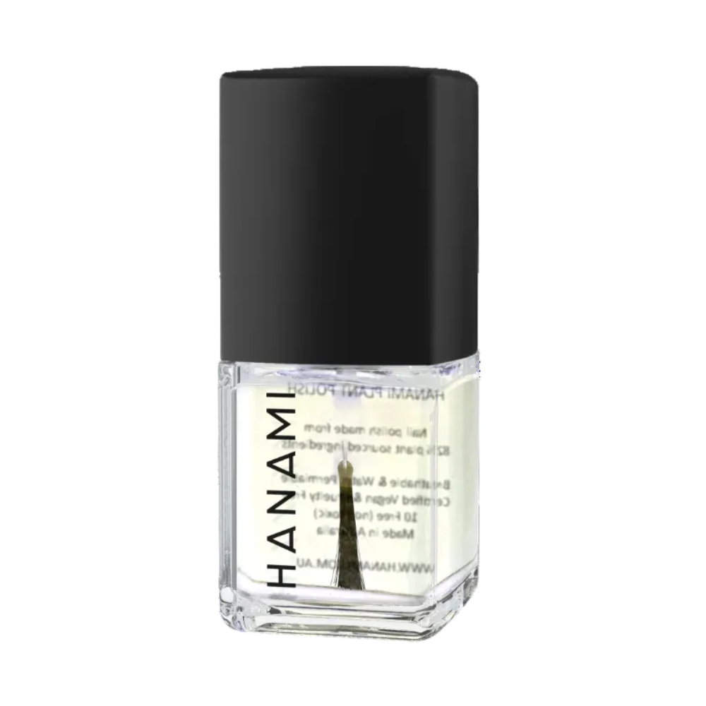 A bottle of Hanami Nail Polish in a clear glass container showing a pale yellow liquid, topped with a matte black cap, on a plain white background.