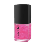 A bottle of Hanami nail polish with a vibrant pink marbled liquid inside a clear glass bottle and a matte black cap, shown on a plain white background.