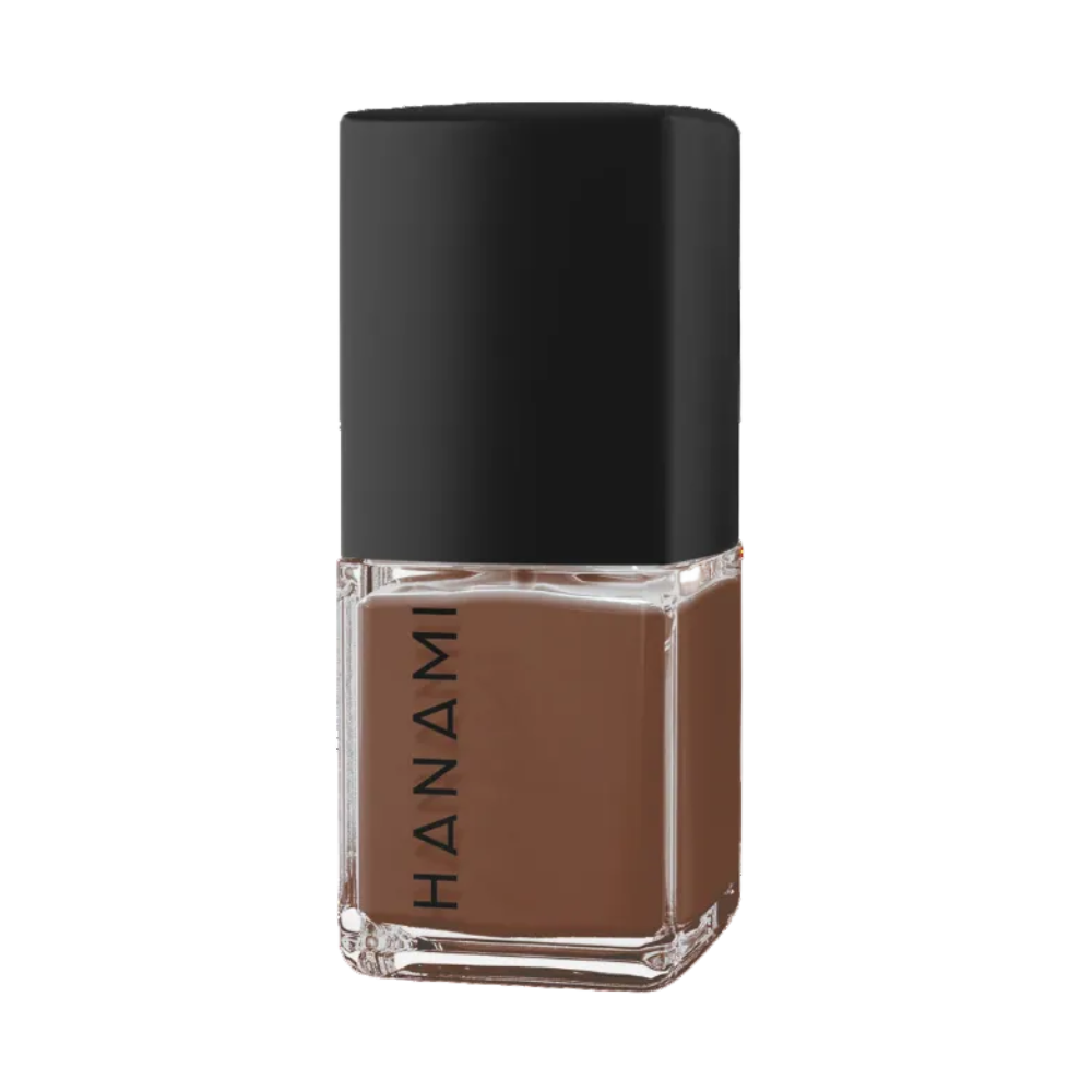 A bottle of Hanami nail polish in a warm medium brown shade, featuring a black cap and a clear glass base, shown on a solid white background.