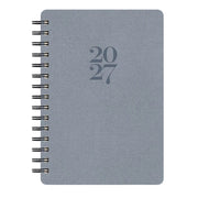 A 2027 spiral-bound planner with a textured slate blue cover and dark gray embossed numbers '2027' in the center, shown on a plain white background.