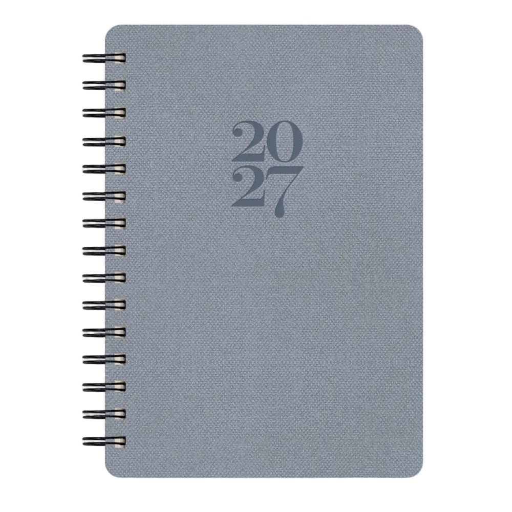 A 2027 spiral-bound planner with a textured slate blue cover and dark gray embossed numbers '2027' in the center, shown on a plain white background.