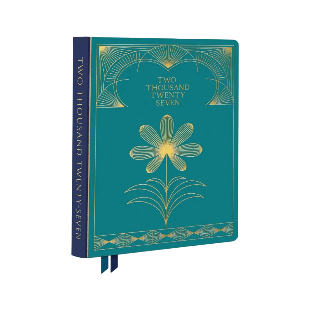 A hardcover notebook or journal titled 'Two Thousand Twenty Seven' with a teal cover and gold Art Deco style floral and geometric line art. The spine is dark teal with gold text, and two dark teal ribbon bookmarks are visible at the bottom.