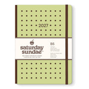 A 2027 B5 hardcover planner by Saturday Sundae, featuring a light olive green cover with brown polka dots and a white paper band around the middle.