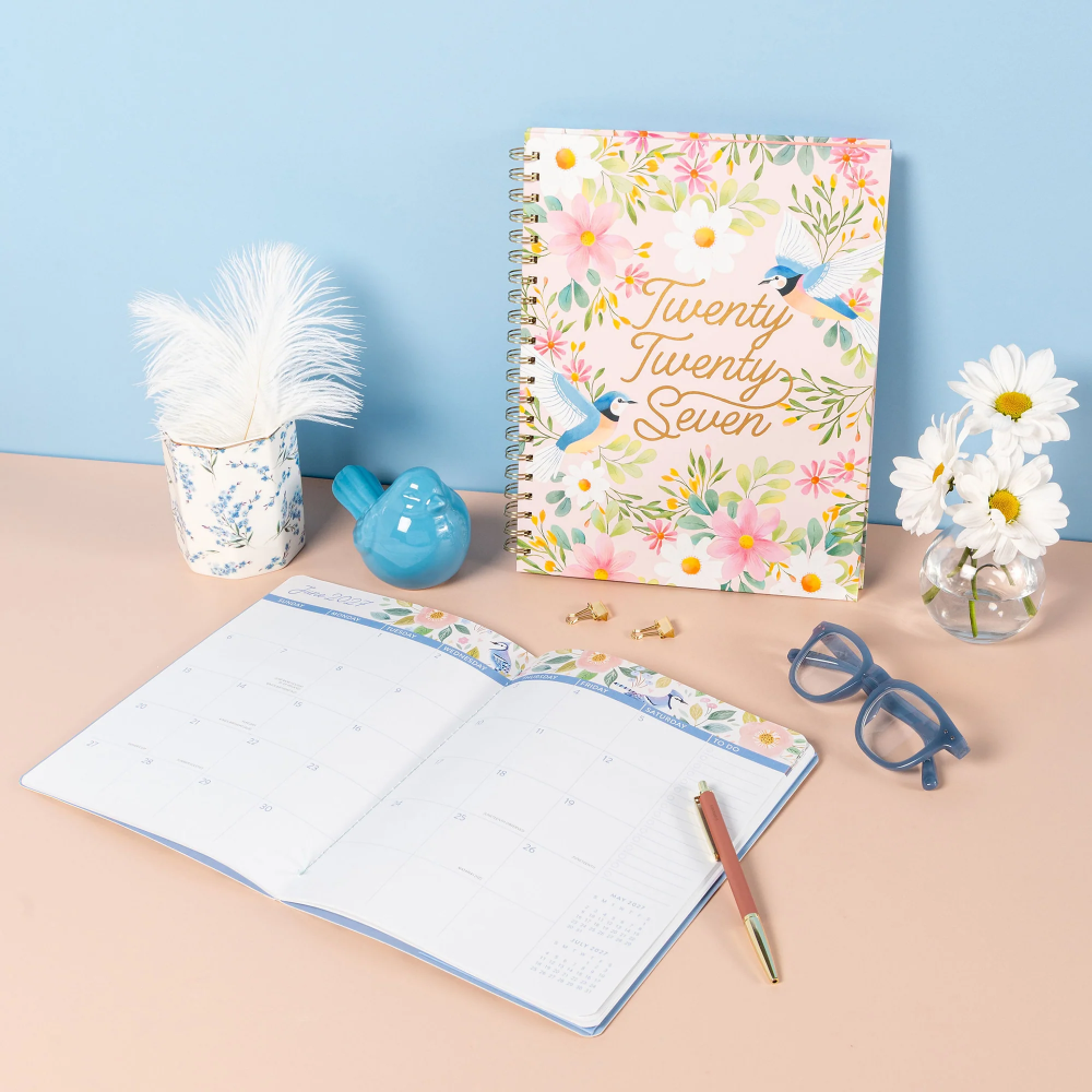 Floral planner with 2027 design on a desk with stationery items
