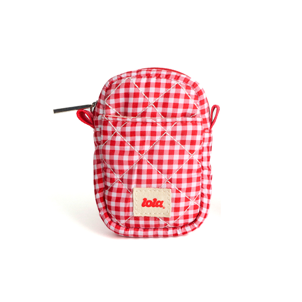 A small quilted red and white gingham pouch with a zipper closure and a beige brand patch reading 'lola' on the front, shown on a clean white background.
