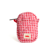 A small quilted red and white gingham pouch with a zipper closure and a beige brand patch reading 'lola' on the front, shown on a clean white background.