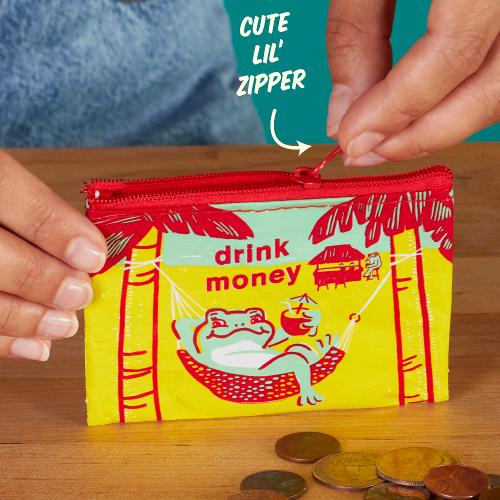 Colorful 'drink money' coin pouch with cartoon design on a wooden surface, surrounded by coins.
