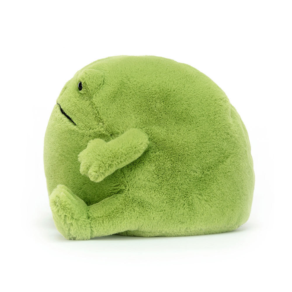 Green plush toy with a sad expression on a white background