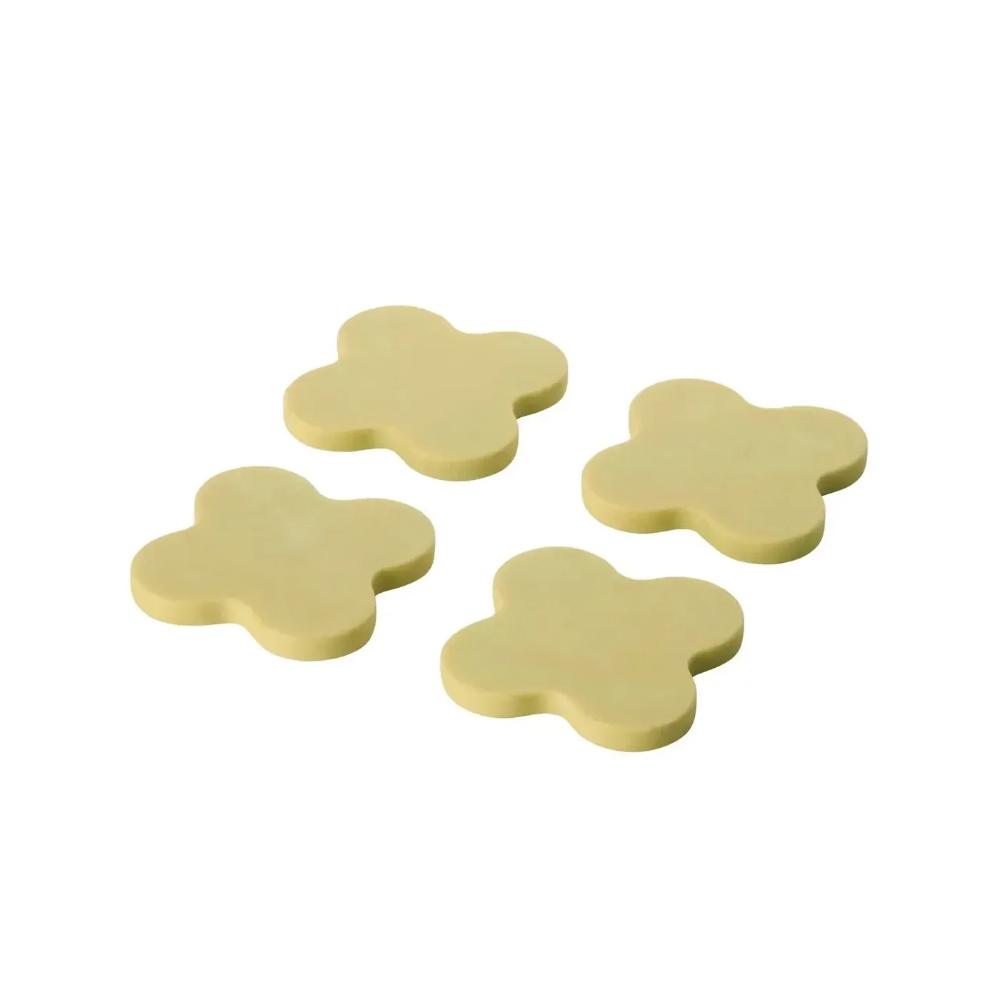 Four yellow flower-shaped objects on a white background