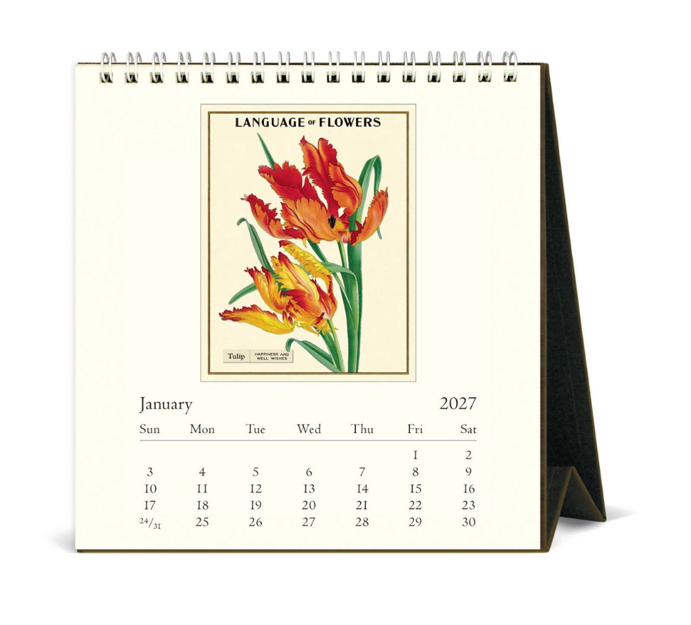 A spiral-bound desk calendar shown open to a January page from 2027, featuring a vintage-style floral illustration with the text 'LANGUAGE = FLOWERS' above the calendar grid.