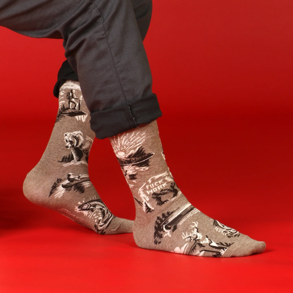 Person wearing patterned socks on a red background