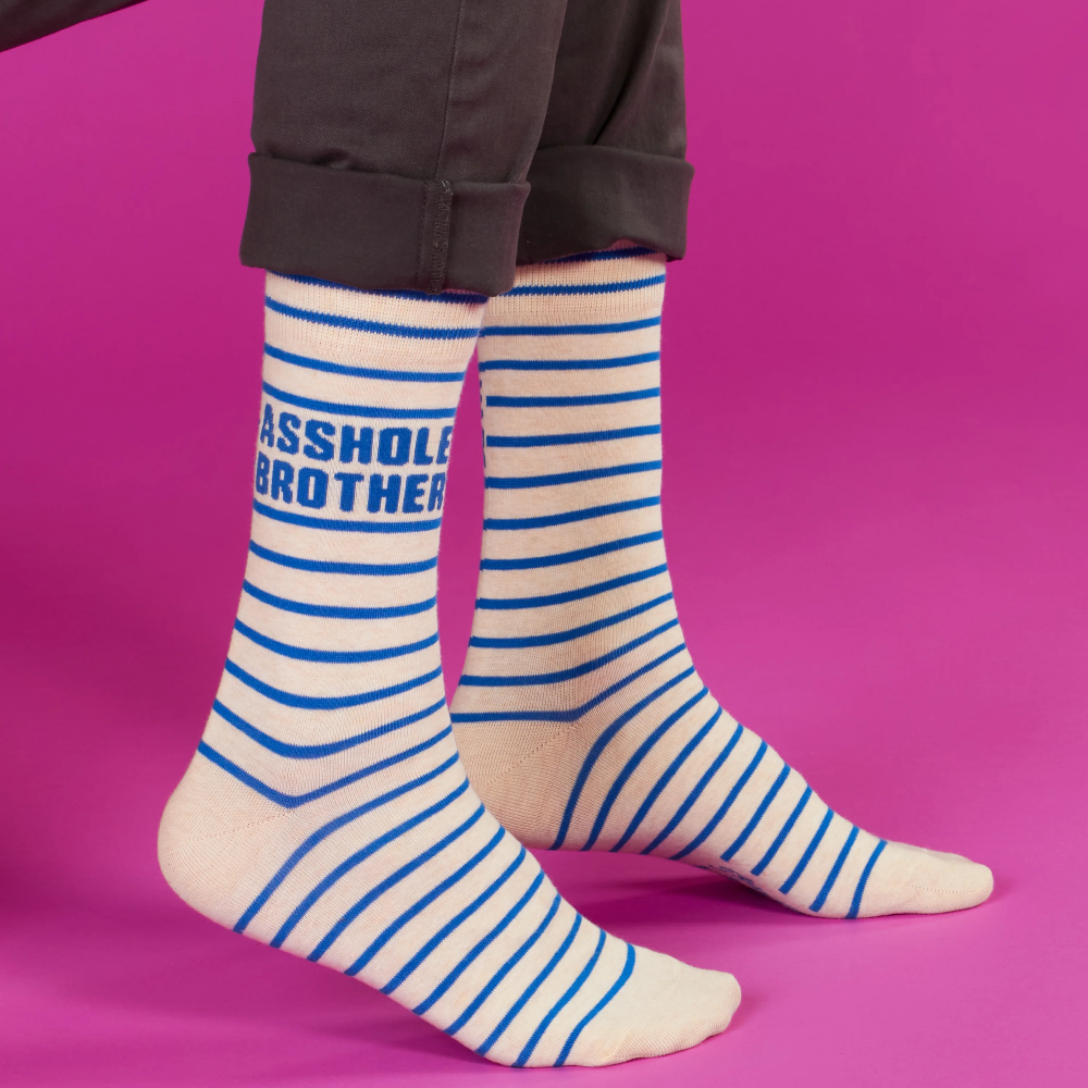 Striped socks with text on a pink background