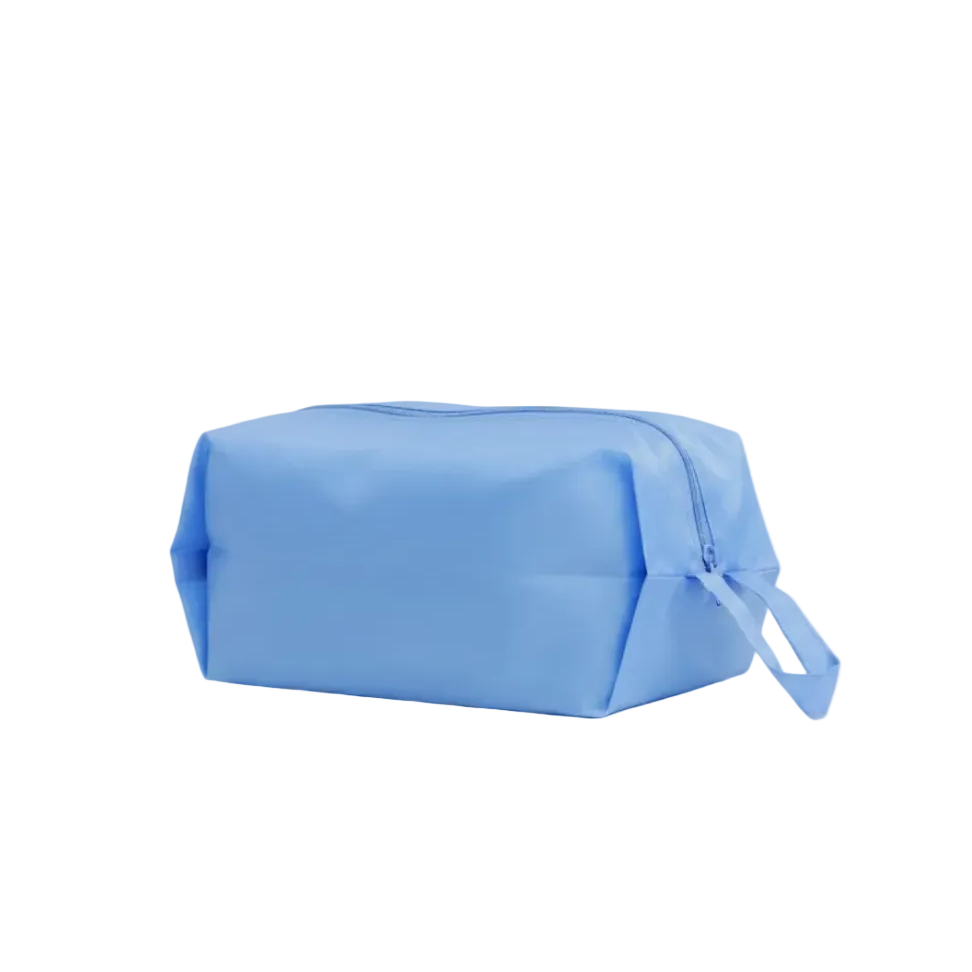 Baggu Blue toiletry bag on a white background