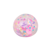A translucent pink stress ball filled with pastel star confetti and a pink heart-shaped insert that reads 'BE HAPPY', shown on a clean white background.