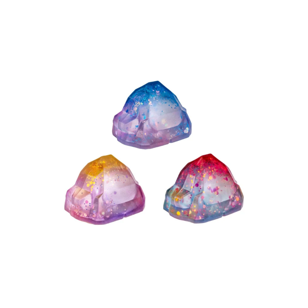 Three colorful, translucent crystal-like objects on a white background