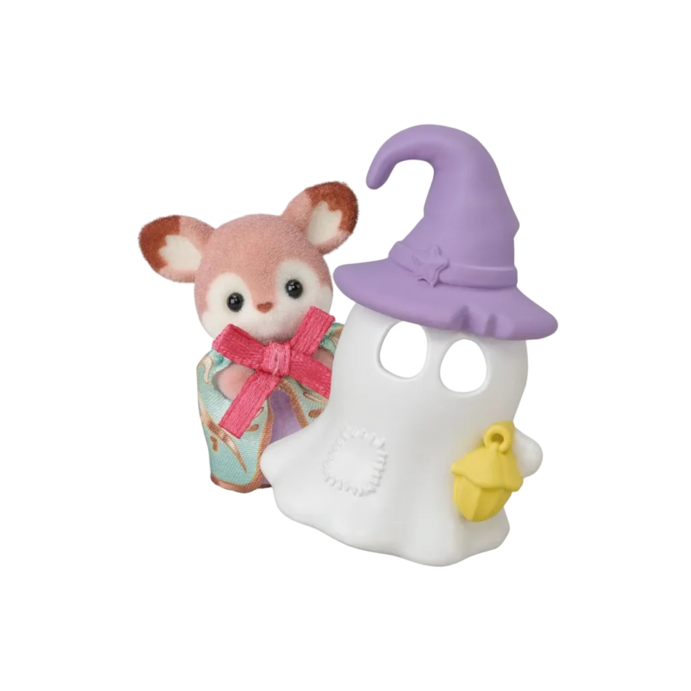 A small plush toy deer character standing beside a white ghost-shaped decoration with a purple witch hat, pink bow, and yellow acorn accessory on a plain white background.